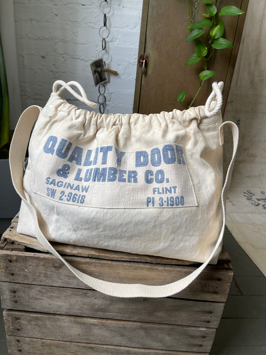 Drawstring Lumber Co. Messenger Bag